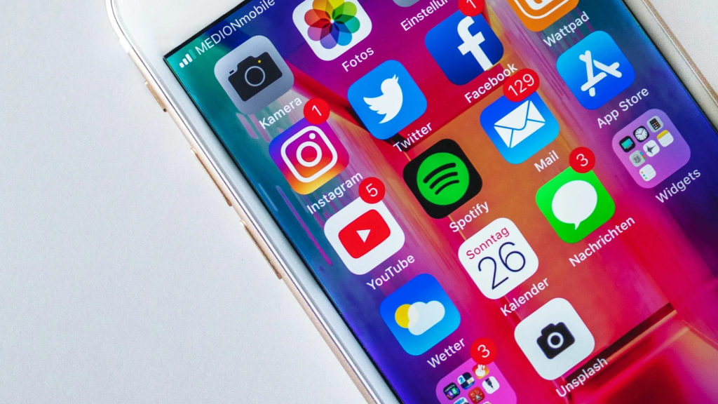 close up image of a cell phone showing social media icons