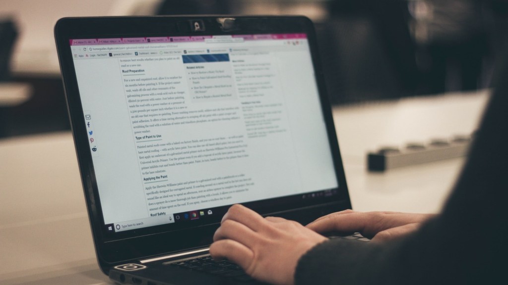 content marketer working on a blog series on a laptop